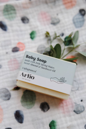 Close-up of Artio unscented baby soap included in Milk + Joy gift set.